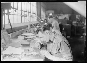 "Ivor Steadman, Litz Manor, Kingsport, Tennessee. Steadman is shown here finishing and patching, an operation requiring a master craftsman. Like Hughes, Steadman was trained entirely by the Kingsport Press. On this work the operator must be able to detect high type, damanged[sic] or incorrect characters, and tell when the plate is absolutely level."